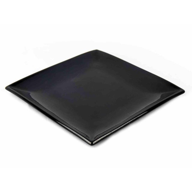 Black porcelain plate is an original decorative object realized in the 1970s. A very elegant porcelain plate black colored...