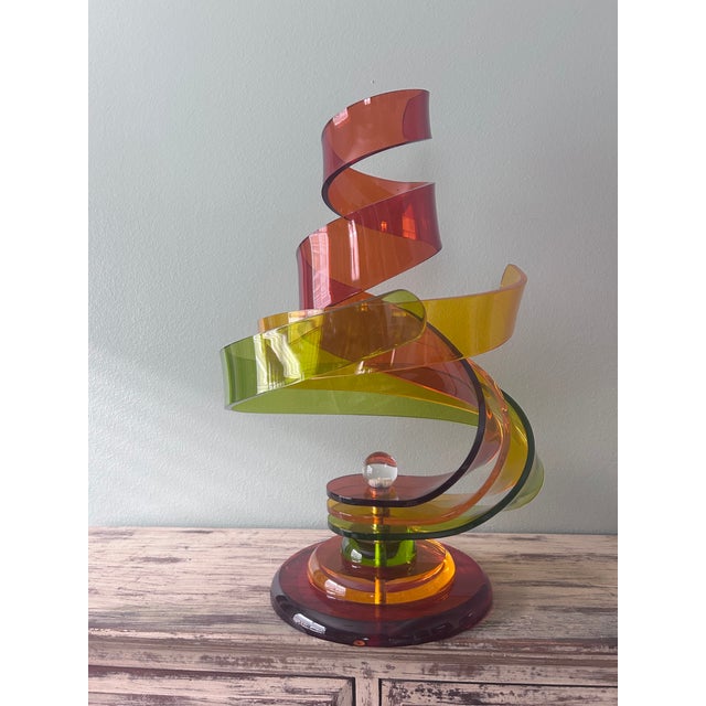 A dramatic large-scale Lucite ribbon sculpture by Haziza Studio (Israel), dating to the late 20th century. This striking...