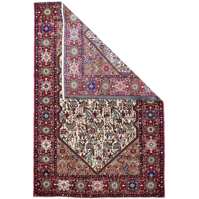 The indented pointed ivory hexagonal subfield displays leaves, flowers and oblique vines in a semi-geometric manner on...