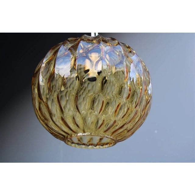 Italian Murano Brass Chandelier from Venini, 1950s, in Very Good conditions. Designed 1950 to 1959 This piece is...
