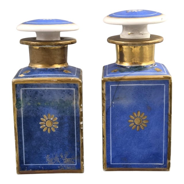 An elegant pair of French Vieux Paris perfume bottles attributed to Jacob Petit, dating to c.1835–1845. Executed in hard-...