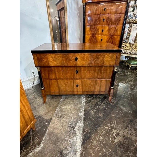 19th century period German Biedermeier walnut commode with ebonized details. A very handsome chest with a gorgeous wood...