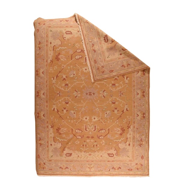 In a semi-geometric style, with broken arabesque tendrils, petal palmettes and colorful leaves, the pattern is vaguely...