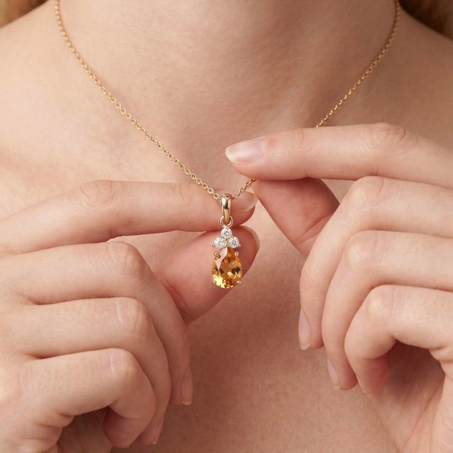 Elevate your jewelry collection with this elegant Natural Citrine Pendant Necklace, beautifully crafted in 18K Gold Plated...
