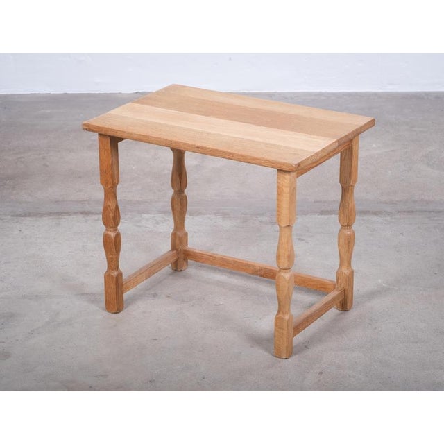A beautiful oak side table from denmark, dating from the 1970s and attributed to henning kjærnulf for eg møbler....
