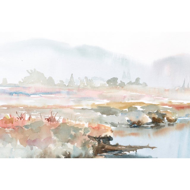 Soft landscape of the edge of a lake with mountains in the background by a California watercolor artist.. Signed in pencil...