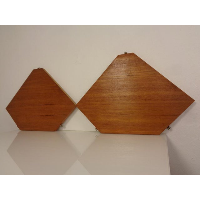 Original string teak corner shelf from the 1950s. I have official proof of authenticity such as vintage catalogs, designer...