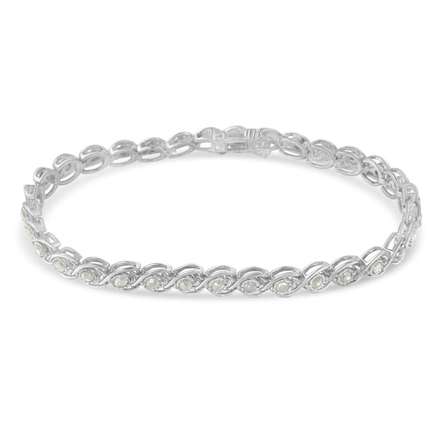 A diamond sterling silver link bracelet that features rose cut diamonds set within a C-form design. There are 33 total...