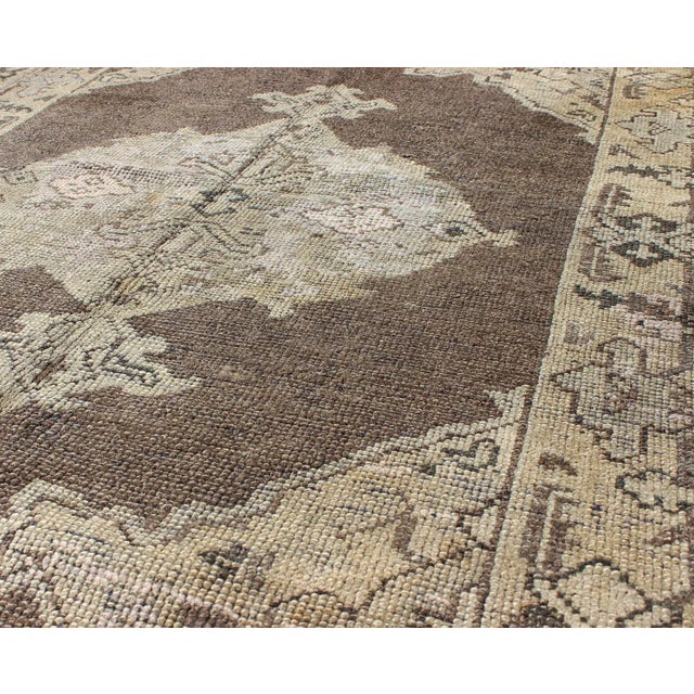 Keivan Woven Arts - Chocolate background vintage Turkish Oushak rug with floral medallion in cream, Keivan Woven Arts /...