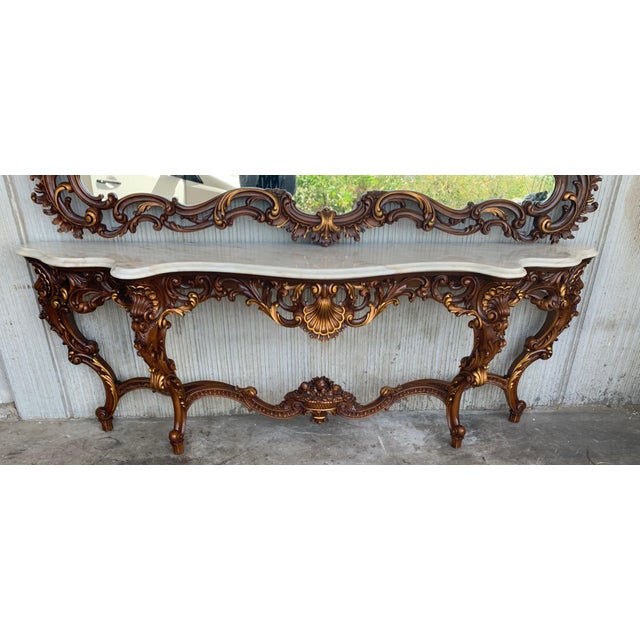 A magnificent and large scale Spanish 20th century Baroque style, ormolu and white marble freestanding console. The most...