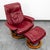 Red leather Stressless lounge chair and ottoman by Ekornes. This piece was designed and constructed in Norway. A classic...