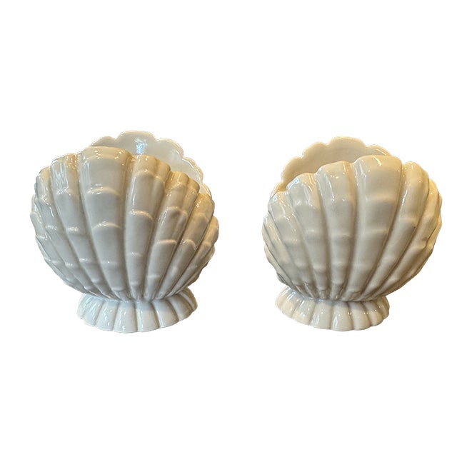 Immediate Palm Beach style! These fabulous, white, shell-shaped candlestick holders will look amazing with candles,...
