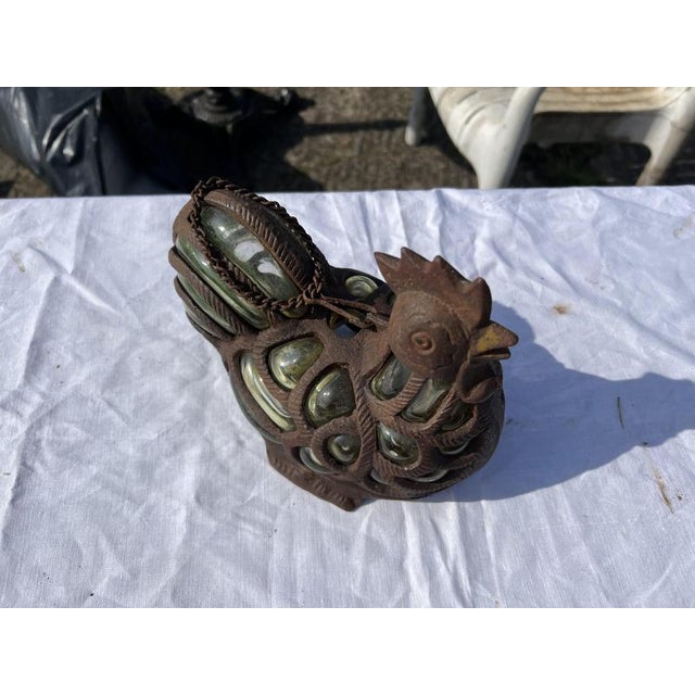 Elegant cast iron and green bubble glass tealight holder/lantern in the form of a chicken with hanging chain.