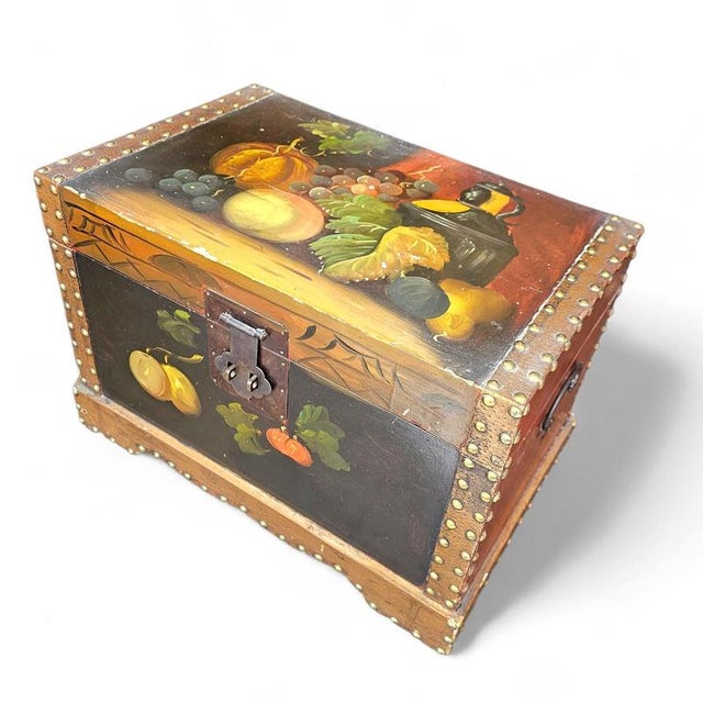 A vintage floral painted dome top trunk a vintage floral painted dome top trunk / 1980s chinese style, studded and with...