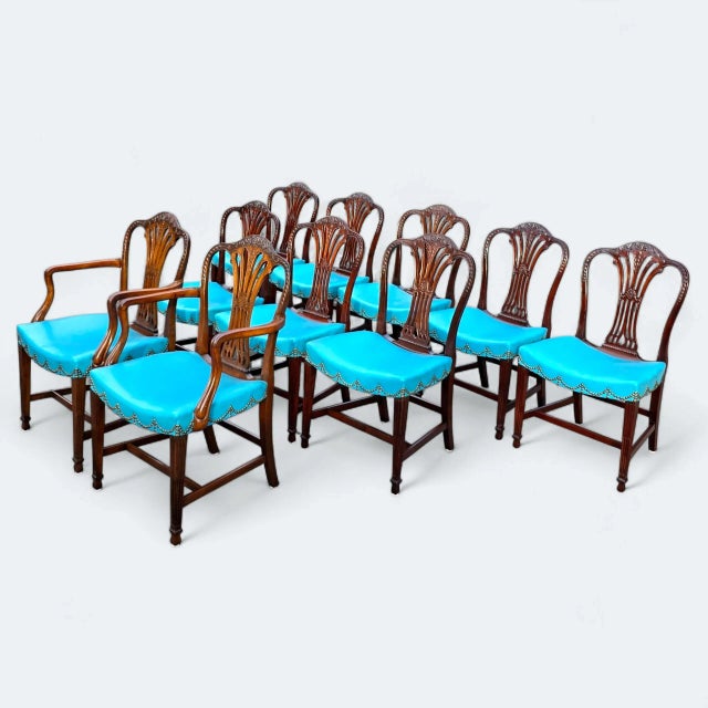This 19th Century Carved Georgian/Hepplewhite Dining Chairs — Set of 10 is an eloquent display of neoclassical design...