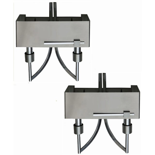 Pair of Italian, circa 1970 brushed and polished steel Two bulbs. Max wattage 60 W each. Wired for US and in working...