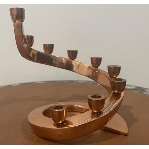Rare vintage copper Hanukkah menorah made in Israel during the 1960s. The piece features a sculptural mid-century design....