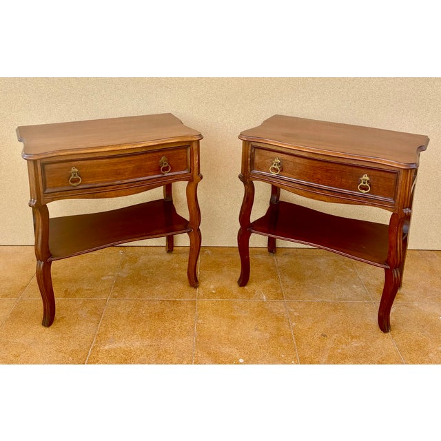 Charming pair of Spanish bedside tables dating from the mid-20th century. Crafted in wood, each table features a spacious...