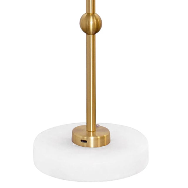 Meet Chanler, the perfect addition to any space. This rechargeable table lamp features a sleek brass and faux alabaster...