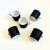 A set of 4 mid century porcelain demitasse mugs. Simple modernist shapes. Finished in a matte black exterior glaze with...