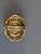 Brass cameo carved shell chiseled came encased in brass. The band is adjustable medium to large.