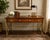This rare and sought after Kittinger Furniture directoire-style desk exemplifies the brand's craftsmanship and classic...