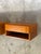 Elegant pair of Danish modern teak floating nightstands featuring single drawers and open storage. These wall-mounted...