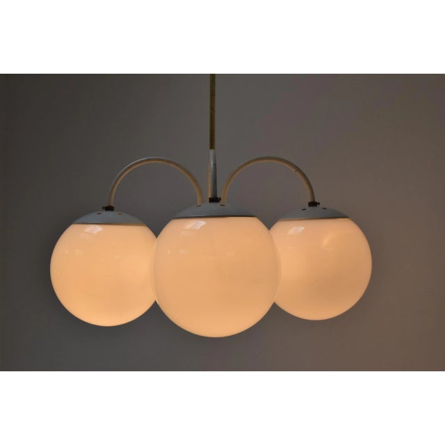 Made in czechoslovakia made of milk glass, brass, lacquered metal 4xe27 or e26 bulb with aged patina re-polished good...