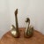 Elevate your decor with this stunning pair of mid-century modern brass swans, a graceful addition to any room. The larger...