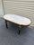 Designer couch table in Louis XVI black, white marble Solid beechwood painted black and with gilded bronze. Slightly...