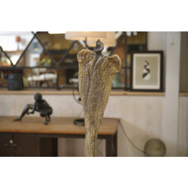 Abstract raku statue, 1960s, with a slender, organic silhouette. a vertical volume resting on a base, its form evokes a...