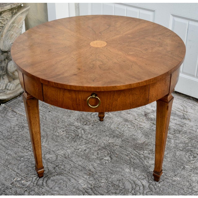 Vintage (1960's) Round Table has a Mid Century Style. Brand is Baker Furniture. The Wood is BurlWood & Fruitwood. The...