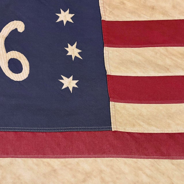 This vintage American Bennington flag is made from a cotton cloth, with fully embroidered emblem and sewn stripes. Please...