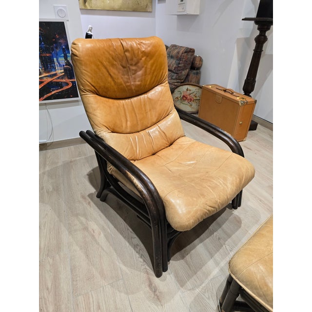 Stunning 1970s lounge set comprising a deep armchair and matching footstool. this piece immediately captivates with its...