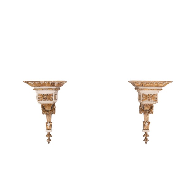 Pair of Neoclassical-Style Parcel-Gilt Composition Brackets, early 19th century, on tapered backplates decorated with...