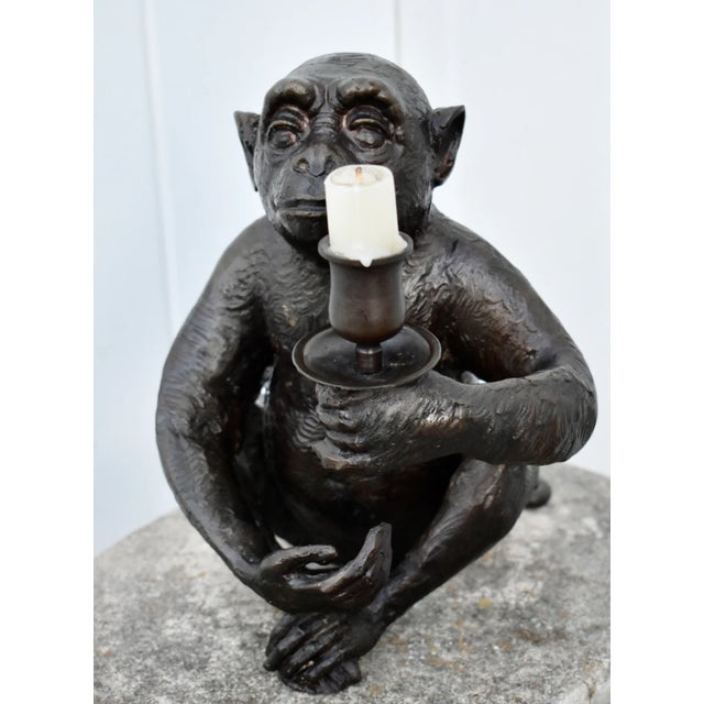 Vintage (1990's) Monkey Candle Holder has a Transitional Style. Made of Bronze. The Measurements: 7.5"W x 8.5"D x 8.75"....