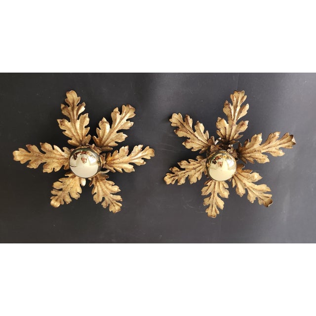 Large, gold-plated, hand-forged Florentine flower-shaped ceiling/wall light with gold leaf design An extraordinary flush...