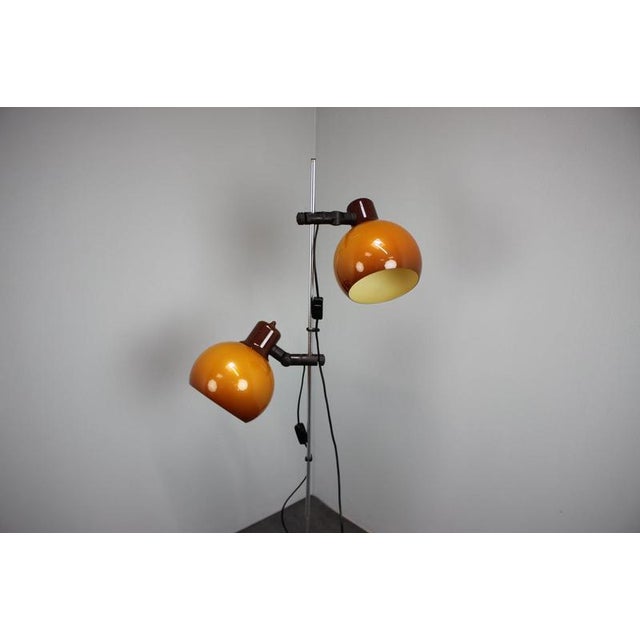 An original Hungarian Space Age floor lamp produced during the 1970s, featuring two adjustable lacquered metal shades in a...