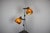 An original Hungarian Space Age floor lamp produced during the 1970s, featuring two adjustable lacquered metal shades in a...