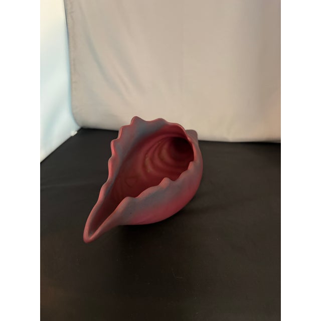 The Van Briggle Pottery Mulberry Conch Shell Planter Vase is a stunning piece of decorative pottery originating from...
