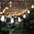 Illuminate your outdoor space with the Dorcia 10 light black string light, a sleek addition to any backyard, patio, or...