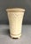 A vintage Lenox footed vase with 24 karat gold trim. The tall ivory vase is part of the Versailles collection and was made...