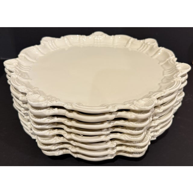 Set of Italian San Marco Creamware 12" chargers with stylized shell and rococo frame pattern. This is a versatile setting...