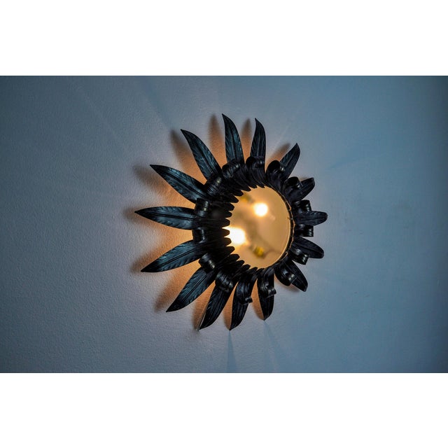 Very beautiful and large sun wall light, designed and produced by Ferro Arte in Spain in the 1960s. Silver metal structure...
