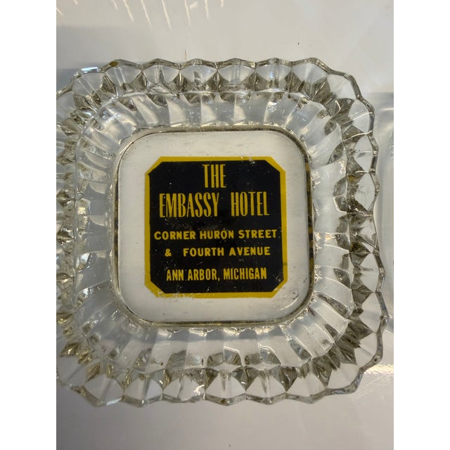Pair of 1960s vintage glass Hotel advertising ashtrays. Made in USA. The Carlyle Hotel NY4” in. square and The Embassy...