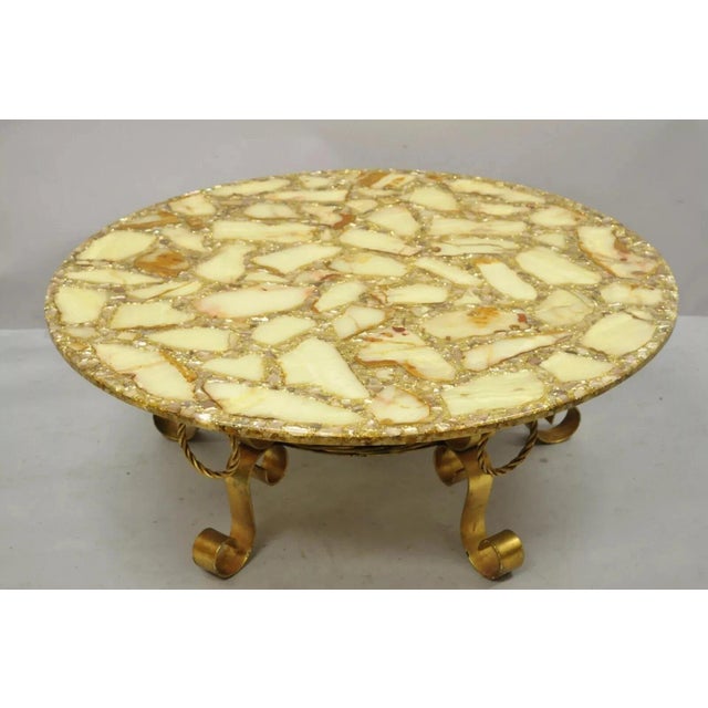 Vintage Hollywood Regency Gold Iron Scroll Agate Stone Specimen Resin Top Coffee Table. Circa Mid 20th Century....