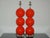 Matched pair of hand blown three ball glass table lamps by Joe Cariati in VERMILLION. Vertical ribs add optical and...