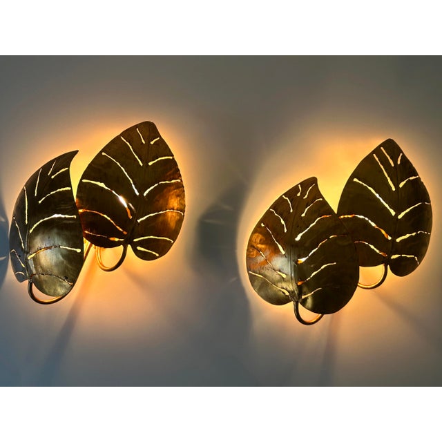 Set of two, large, rare and highly decorative mid-century modern double leaves 'monstera' sconces or wall fixtures....