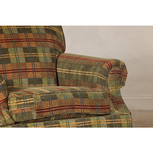 A pair of Kravet club chairs with plaid upholstery. This pair of handmade upholstered club chairs by Kravet combines...