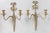 A gorgeous pair of antique early 20th-Century French Neoclassical style brass two arm candle wall sconces. These beautiful...